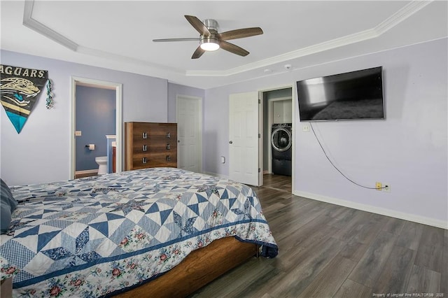 1214 Herring Gull Dr, Fayetteville, NC 28306 - bedroom featuring washer / dryer, wood finished floors, a tray ceiling, ensuite bath, and a ceiling fan