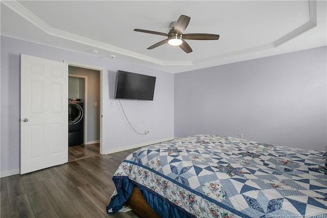 1214 Herring Gull Dr, Fayetteville, NC 28306 - bedroom featuring a raised ceiling, wood finished floors, washer / dryer, ceiling fan, and crown molding