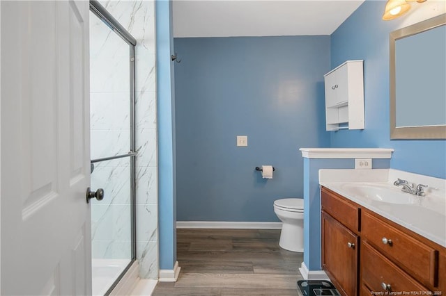 1214 Herring Gull Dr, Fayetteville, NC 28306 - bathroom with a marble finish shower, vanity, and wood finished floors