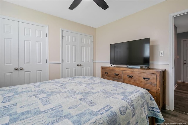1214 Herring Gull Dr, Fayetteville, NC 28306 - bedroom with multiple closets, dark wood-type flooring, and ceiling fan