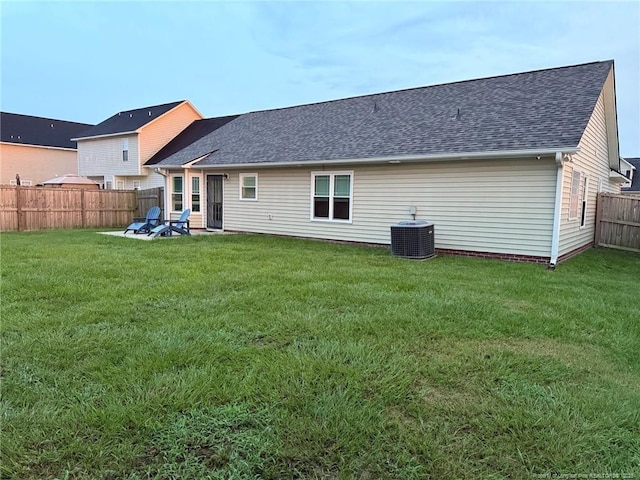 1214 Herring Gull Dr, Fayetteville, NC 28306 - rear view of property featuring a fenced backyard and roof with shingles