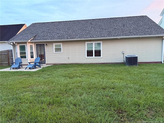 1214 Herring Gull Dr, Fayetteville, NC 28306 - back of property featuring roof with shingles and a patio