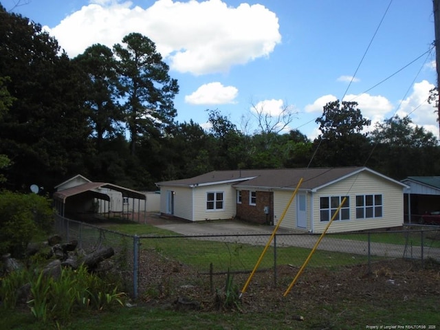 2631 Stonehaven Dr, Fayetteville, NC 28306 - rear view of property with a carport and driveway