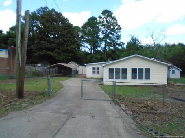 2631 Stonehaven Dr, Fayetteville, NC 28306 - view of front of house with a carport, driveway, a gate, and crawl space