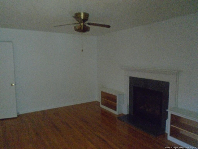 2631 Stonehaven Dr, Fayetteville, NC 28306 - unfurnished living room with a ceiling fan, a fireplace, and wood finished floors