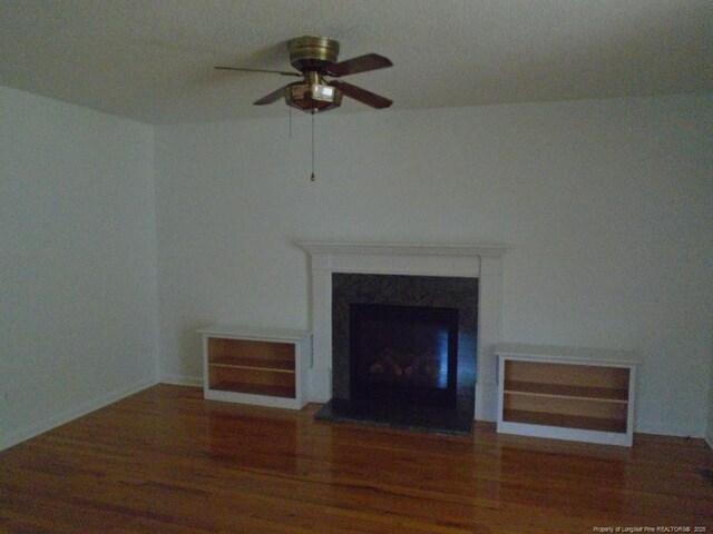 2631 Stonehaven Dr, Fayetteville, NC 28306 - unfurnished living room featuring ceiling fan, a fireplace, and wood finished floors