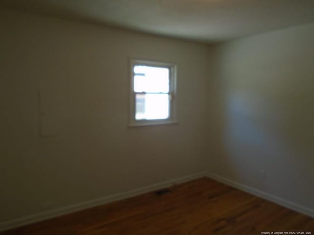 2631 Stonehaven Dr, Fayetteville, NC 28306 - empty room featuring dark wood-type flooring and baseboards
