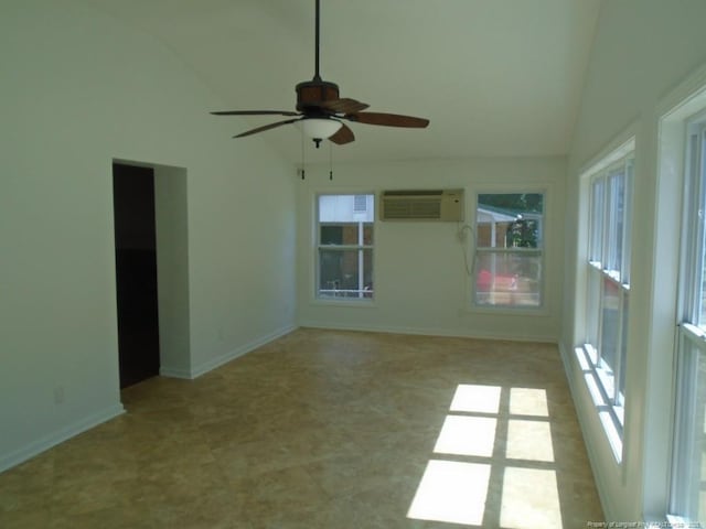 2631 Stonehaven Dr, Fayetteville, NC 28306 - empty room featuring a wall unit AC, ceiling fan, and high vaulted ceiling