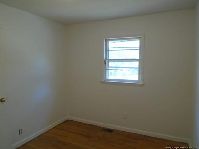 2631 Stonehaven Dr, Fayetteville, NC 28306 - unfurnished room with baseboards and wood finished floors