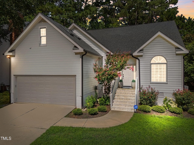 2104 Longwood Dr, Raleigh, NC 27612 - view of front facade featuring concrete driveway, an attached garage, and a shingled roof