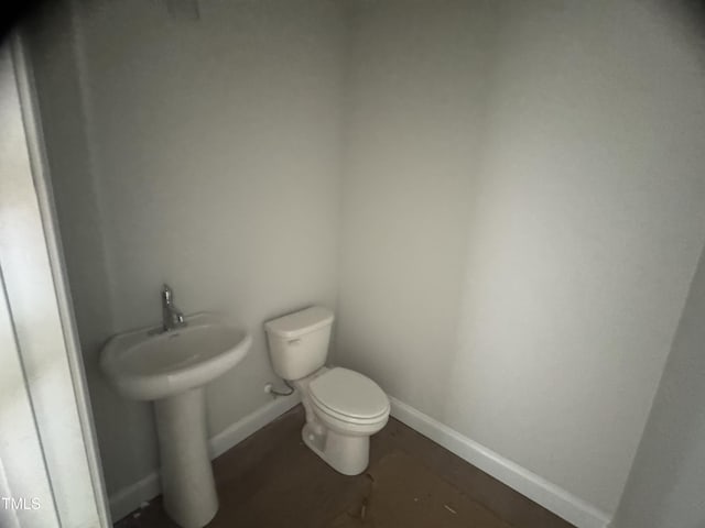 5486 Jaeger Dr Lot # 37, Graham, NC 27253 - half bathroom featuring toilet and baseboards