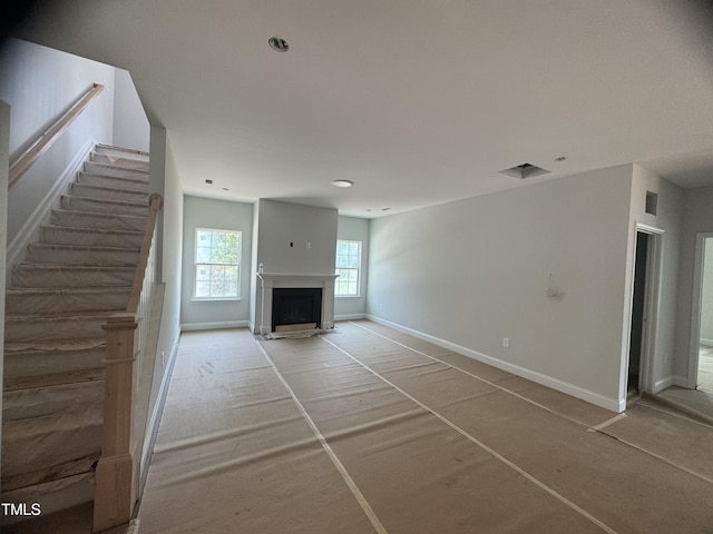 5486 Jaeger Dr Lot # 37, Graham, NC 27253 - unfurnished living room with stairs and a fireplace with flush hearth