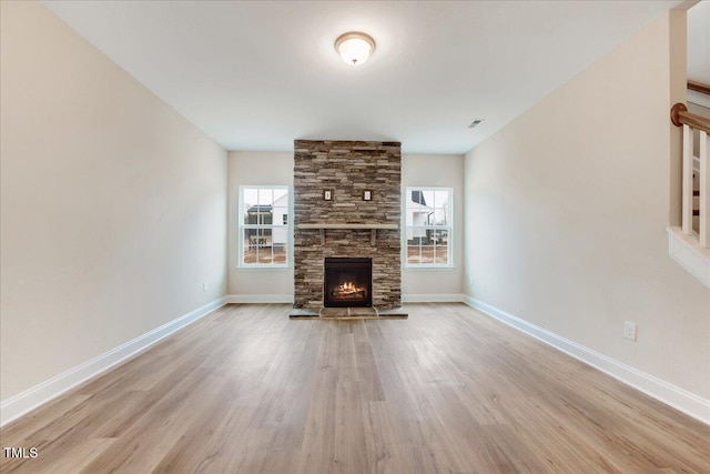 5486 Jaeger Dr Lot # 37, Graham, NC 27253 - unfurnished living room featuring wood finished floors and a fireplace