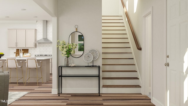 884 Cassa Clubhouse Way, Knightdale, NC 27545 - stairs with wood finished floors and ornamental molding