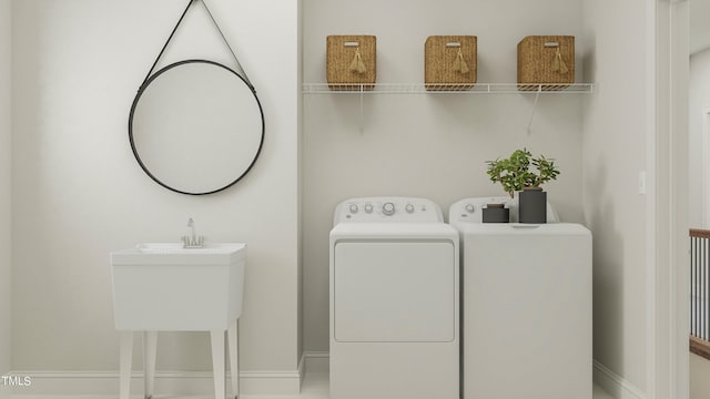 884 Cassa Clubhouse Way, Knightdale, NC 27545 - laundry area with washing machine and clothes dryer and baseboards