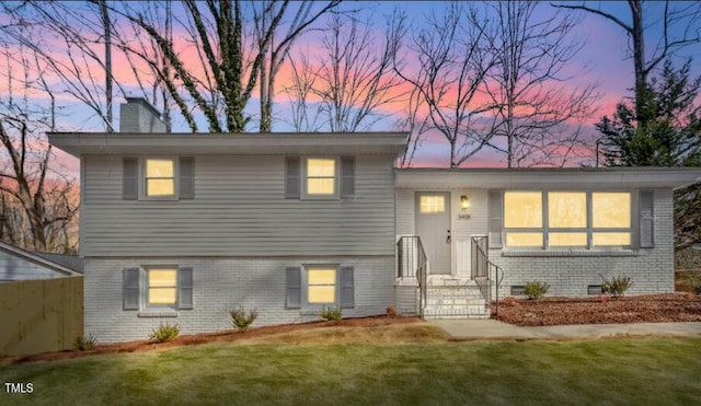 3408 Brentwood Rd, Raleigh, NC 27604 - split level home with brick siding, a chimney, and crawl space