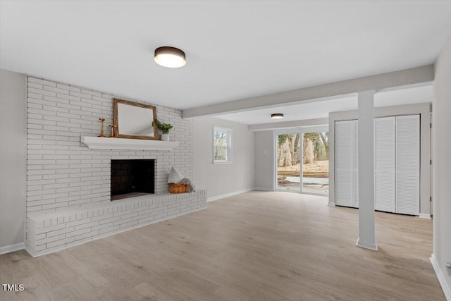3408 Brentwood Rd, Raleigh, NC 27604 - unfurnished living room with wood finished floors and a fireplace