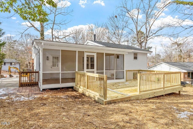 3408 Brentwood Rd, Raleigh, NC 27604 - rear view of property with a sunroom, a chimney, and a wooden deck