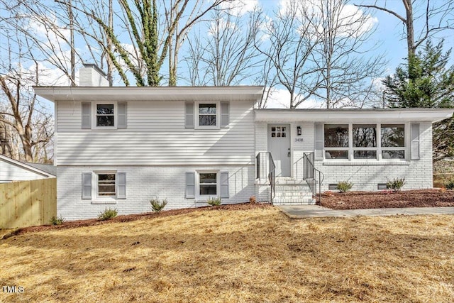 3408 Brentwood Rd, Raleigh, NC 27604 - tri-level home featuring brick siding and a chimney