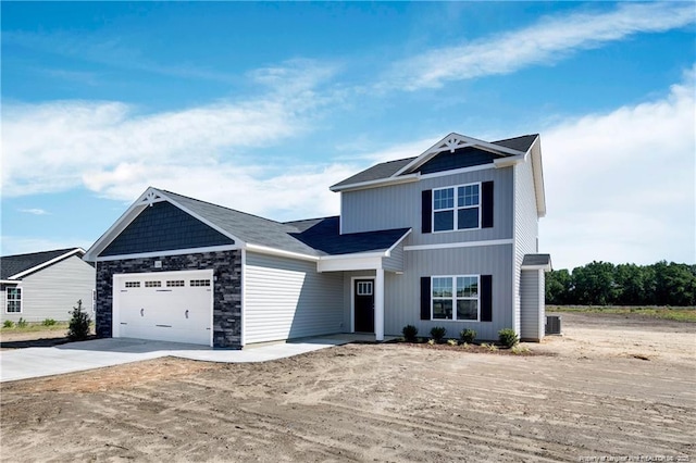 2677 NC Highway 20 W, Saint Pauls, NC 28384 - view of front of property with a garage, concrete driveway, and stone siding