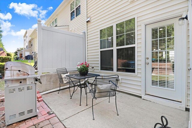 100 Stratford Lakes Dr # 322, Durham, NC 27713 - view of patio featuring a grill and outdoor dining area