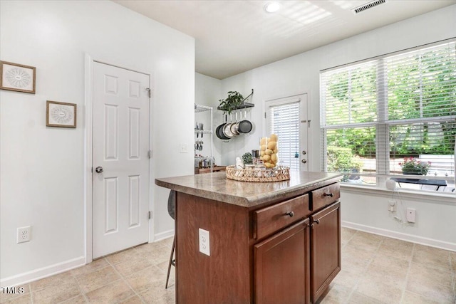 100 Stratford Lakes Dr # 322, Durham, NC 27713 - kitchen with a center island and a kitchen breakfast bar
