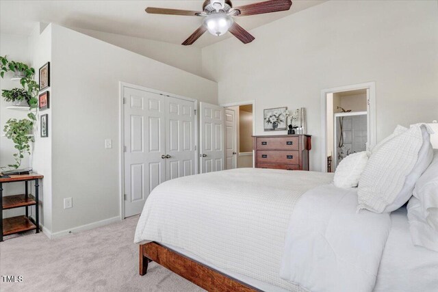 100 Stratford Lakes Dr # 322, Durham, NC 27713 - bedroom featuring vaulted ceiling, light carpet, a closet, a ceiling fan, and connected bathroom