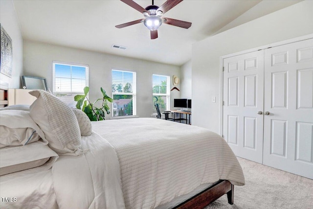 100 Stratford Lakes Dr # 322, Durham, NC 27713 - carpeted bedroom with lofted ceiling, a ceiling fan, and a closet