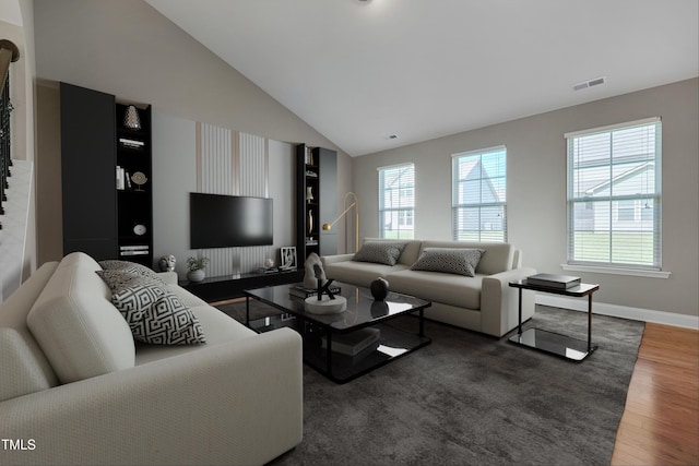 615 Fairway Dr, Mebane, NC 27302 - living room featuring wood finished floors and high vaulted ceiling
