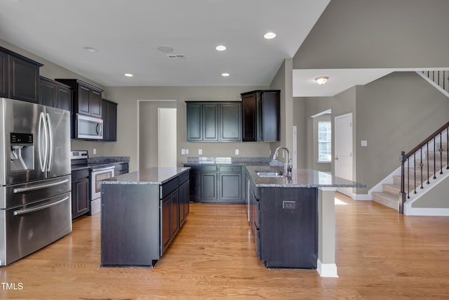 615 Fairway Dr, Mebane, NC 27302 - kitchen featuring appliances with stainless steel finishes, a peninsula, stone countertops, a center island, and recessed lighting