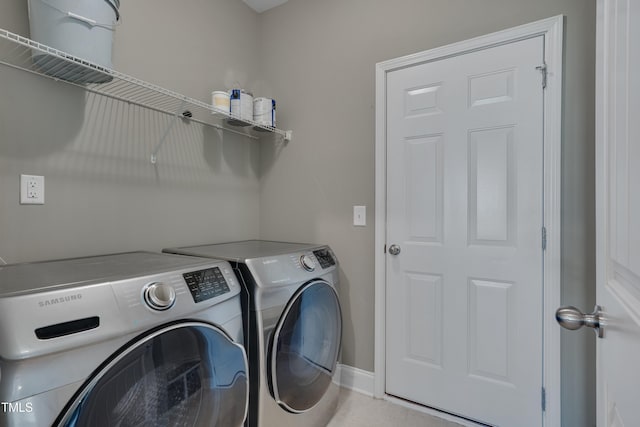 615 Fairway Dr, Mebane, NC 27302 - laundry area with washer and dryer and baseboards