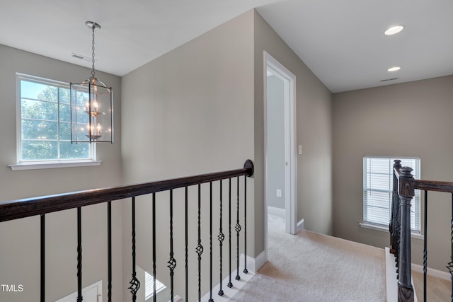 615 Fairway Dr, Mebane, NC 27302 - corridor featuring an upstairs landing, light colored carpet, a chandelier, and recessed lighting