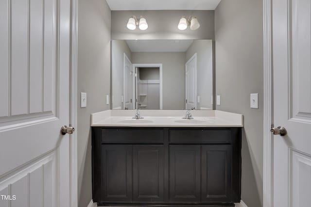 615 Fairway Dr, Mebane, NC 27302 - bathroom featuring double vanity and baseboards