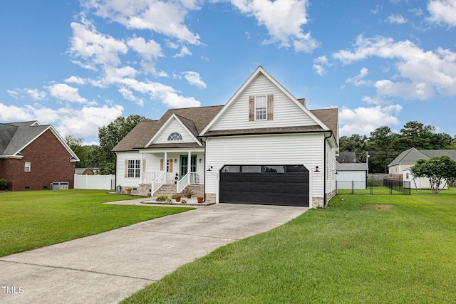 305 Maddux Dr, Pikeville, NC 27863 - view of front facade with covered porch, driveway, a garage, and a shingled roof