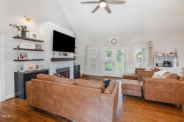 305 Maddux Dr, Pikeville, NC 27863 - living area with wood finished floors, a ceiling fan, a fireplace, and high vaulted ceiling
