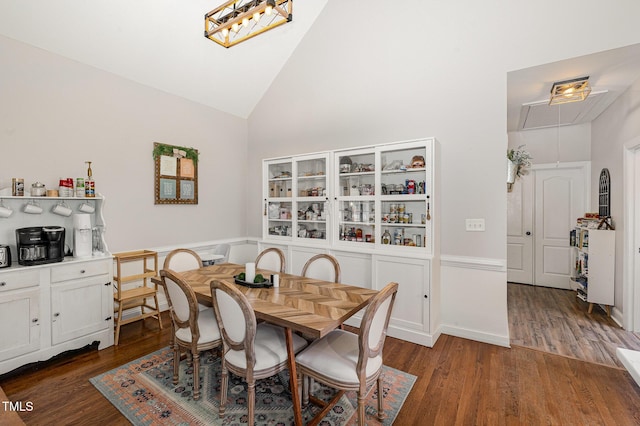 305 Maddux Dr, Pikeville, NC 27863 - dining space with attic access, wood finished floors, and high vaulted ceiling