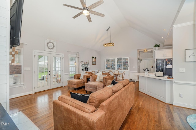 305 Maddux Dr, Pikeville, NC 27863 - living area with light wood-style flooring, a ceiling fan, high vaulted ceiling, and french doors