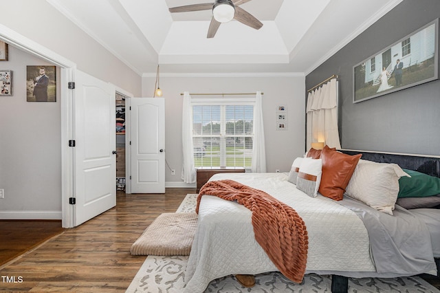 305 Maddux Dr, Pikeville, NC 27863 - bedroom with a raised ceiling, wood finished floors, ceiling fan, and ornamental molding