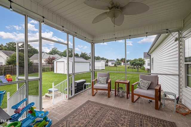 305 Maddux Dr, Pikeville, NC 27863 - sunroom / solarium featuring ceiling fan and a residential view