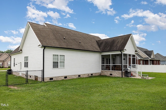 305 Maddux Dr, Pikeville, NC 27863 - back of house with crawl space, a sunroom, a shingled roof, and a gate