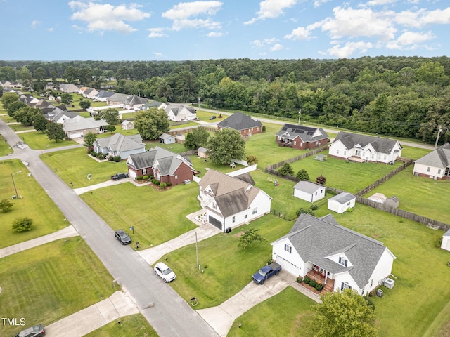 305 Maddux Dr, Pikeville, NC 27863 - aerial perspective of suburban area featuring a forest
