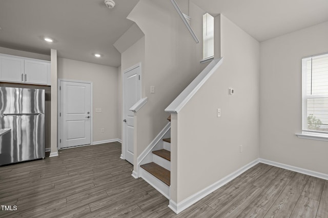 348 Abbots Mill Dr, Raleigh, NC 27603 - stairs with wood finished floors and recessed lighting