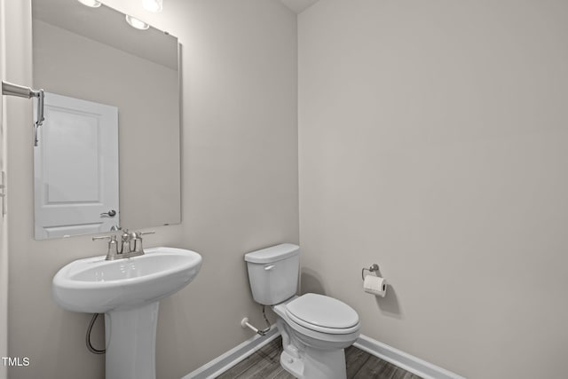 348 Abbots Mill Dr, Raleigh, NC 27603 - half bath featuring wood finished floors and baseboards