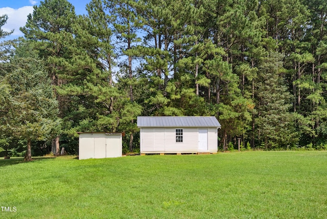 7060 Dirgie Mine Rd, Roxboro, NC 27574 - view of green lawn featuring a storage unit