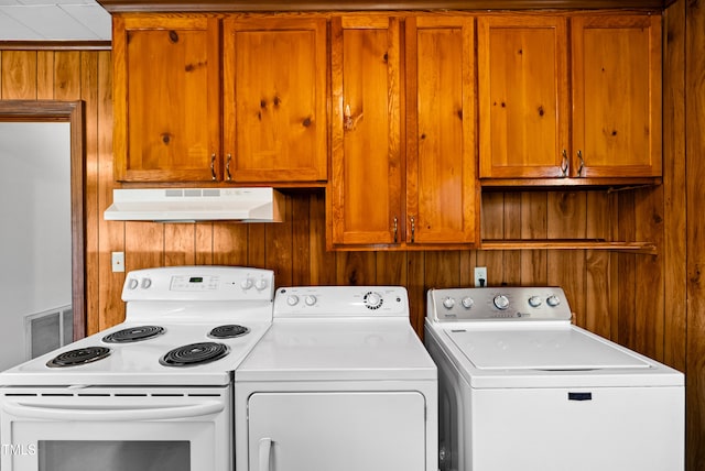 7060 Dirgie Mine Rd, Roxboro, NC 27574 - laundry area featuring washing machine and dryer and wood walls