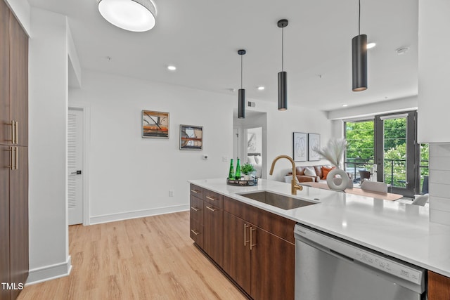 615 W Peace St Unit 302, Raleigh, NC 27605 - kitchen with dishwasher, light wood-style floors, light countertops, open floor plan, and recessed lighting