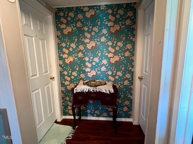 174 Daffodil Dr, Henderson, NC 27537 - bedroom / living area view of wood finished floors and wallpapered walls