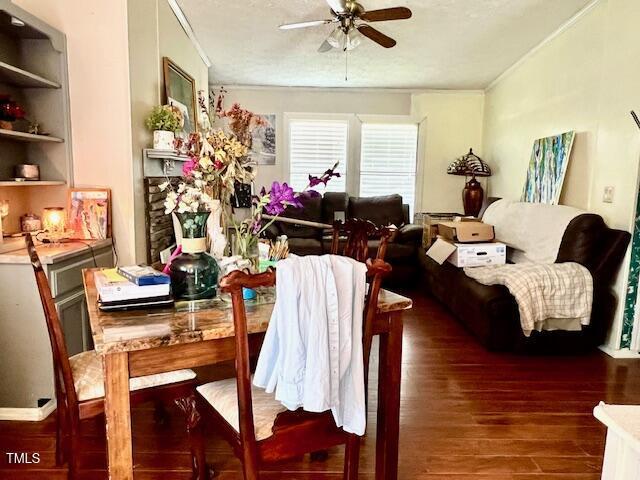 174 Daffodil Dr, Henderson, NC 27537 - dining space with a ceiling fan, wood finished floors, and ornamental molding