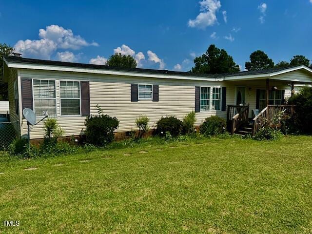174 Daffodil Dr, Henderson, NC 27537 - view of front of home with a front yard, covered porch, and crawl space