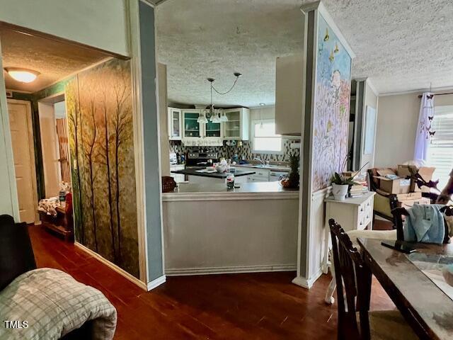 174 Daffodil Dr, Henderson, NC 27537 - dining area with a textured ceiling and wood finished floors